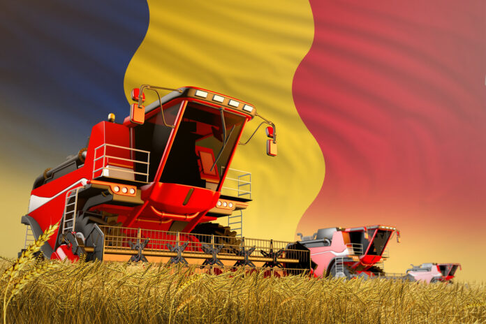 Agricultural,Combine,Harvester,Working,On,Wheat,Field,With,Romania,Flag
